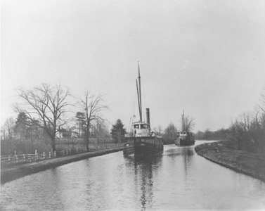 It has been written that the uniqueness of the Delaware and Raritan Canal lay in the wide variety of vessels that used it.  No single type of vessel is associated with the canal, although after the 1850s, small steam-powered tugs and freighters predominated.  The canal’s width, depth and unlimited clearance encouraged a variety of high mast vessels with a carrying capacity of several hundred tons.  The canal also pioneered the introduction of steam powered vessels.  In 1839, the Robert F. Stockton (renamed the New Jersey), was built in England for the Delaware and Raritan Canal Company.  It was the first iron hull vessel to cross the Atlantic, and the first commercially successful propeller-driven vessel in America.